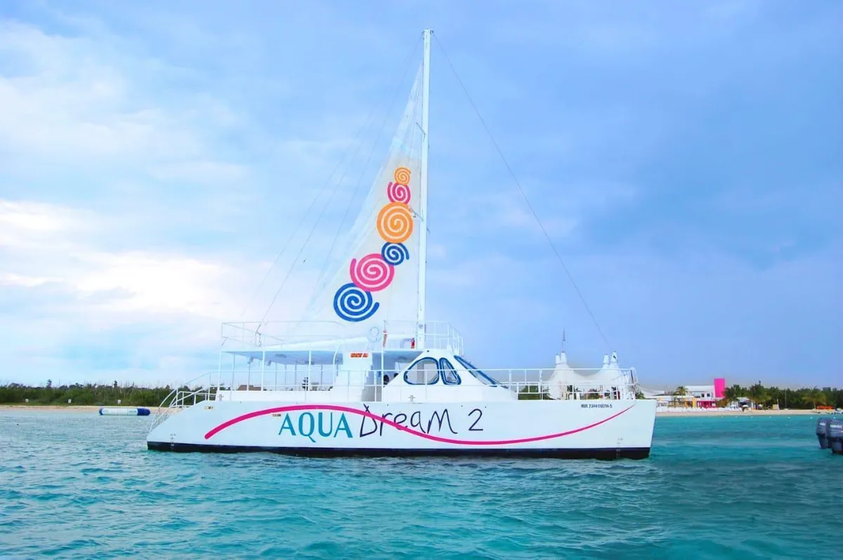 Catamaran anchored over the shallow turquoise sandbar at El Cielo on a full-day Cozumel boat tour